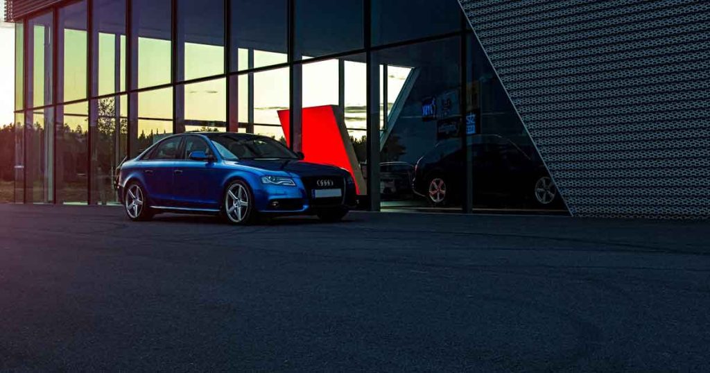 A car parked outside a dealership How to Pre-Qualify for an Auto Loan